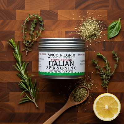 Spice Pilgrim Italian seasoning can on a wooden surface with herbs and lemon