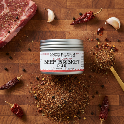 Spice Pilgrim Beef Brisket Rub on a wooden cutting board with ingredients