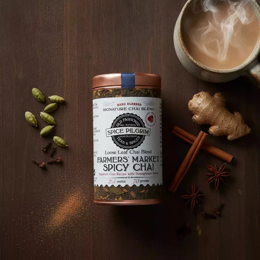An container of Farmers' Market Spicy Chai sits centered on a walnut surface